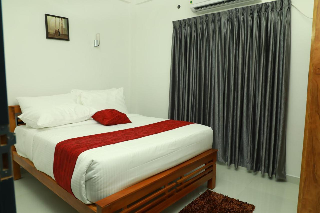 Achoos Residency Hotel Tiruvalla Exterior foto